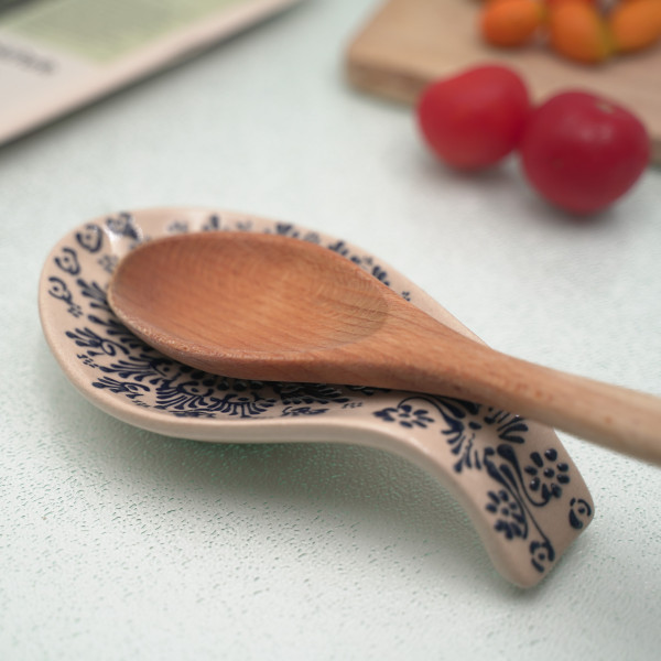 Ceramic spoon rest with unique handmade painting, embossed with blue authentic patterns