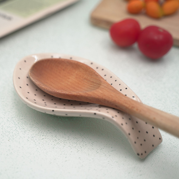 Ceramic spoon rest with unique handmade painting, embossed with authentic patterns