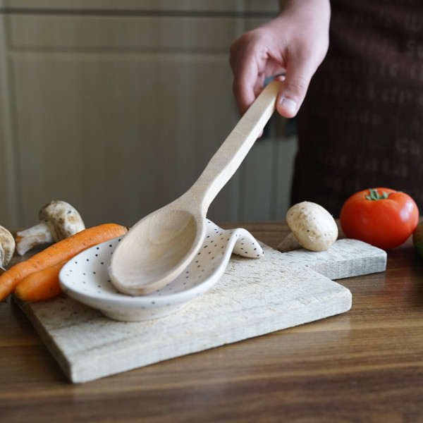 Ceramic spoon rest with unique handmade painting, embossed with authentic patterns