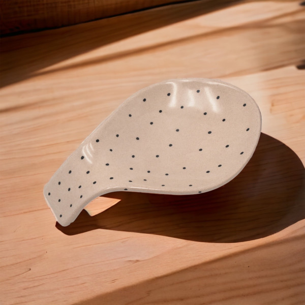 Ceramic spoon rest with unique handmade painting, embossed with authentic patterns