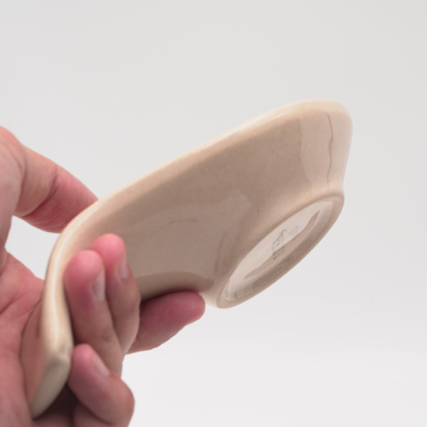 Ceramic spoon rest with unique handmade painting, embossed with red authentic patterns